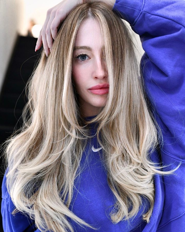 Long Hair with Collarbone Length Layers and Dark Blonde Lowlights